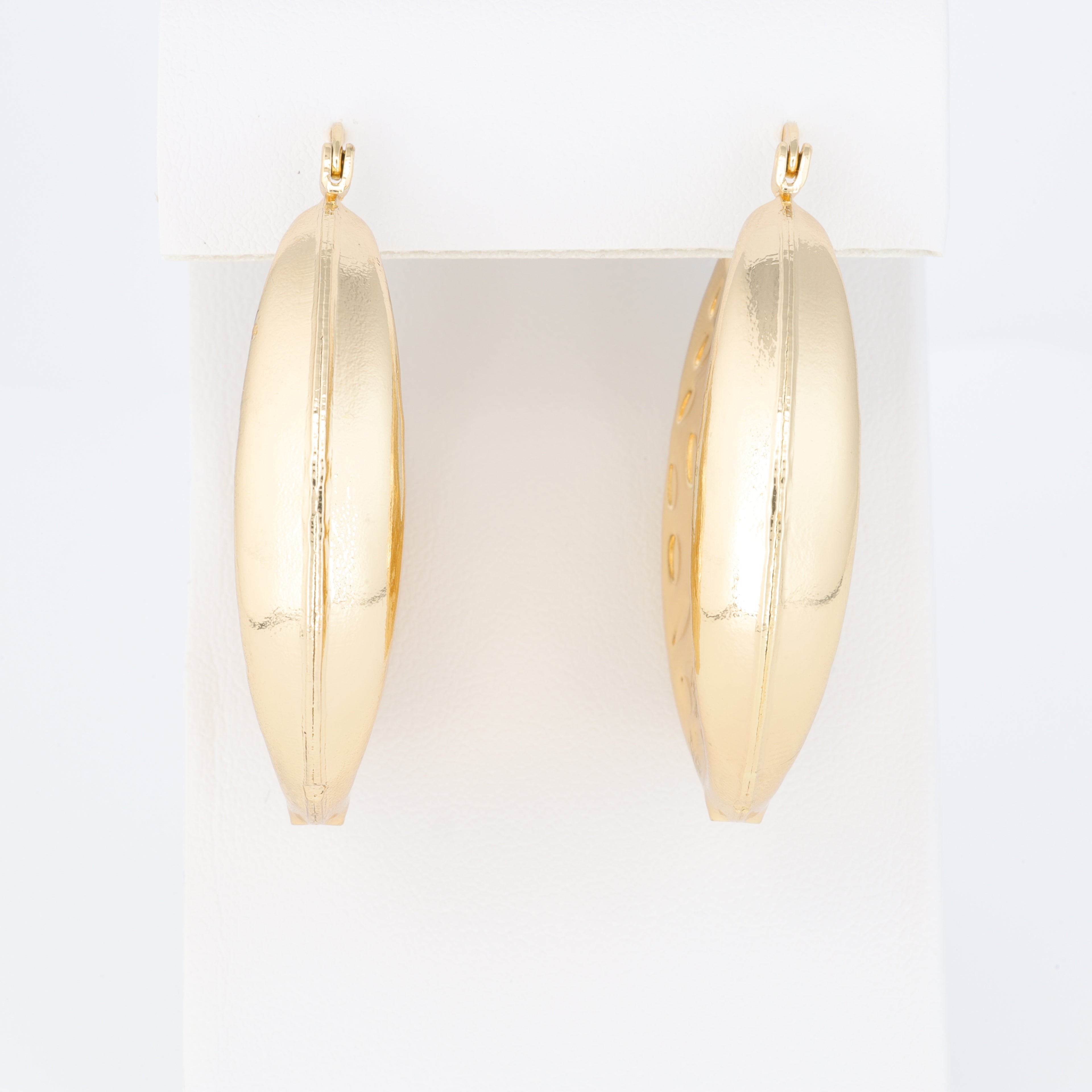 Hoop Earring With A Different Texture And Oval Designs