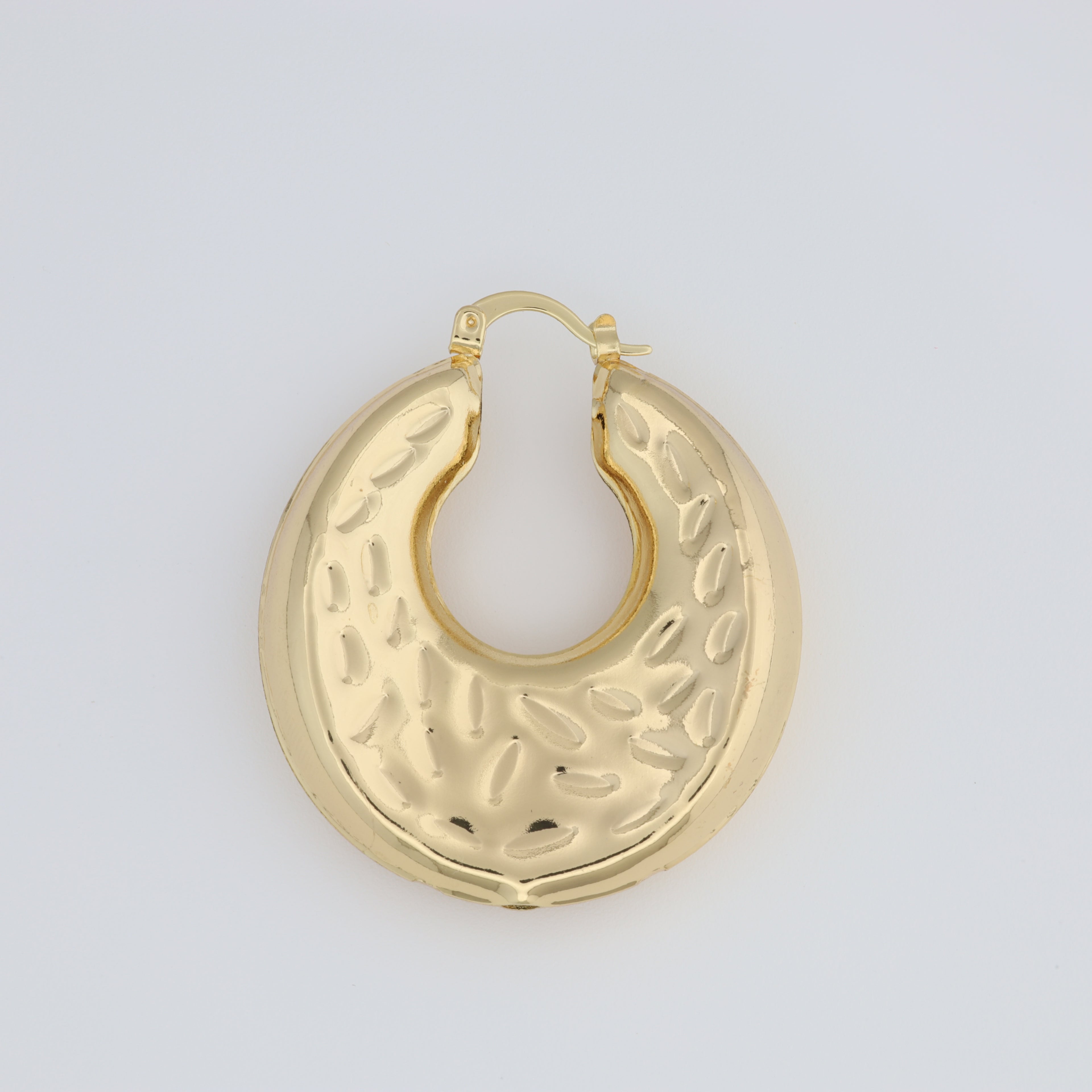 Hoop Earring With A Different Texture And Oval Designs