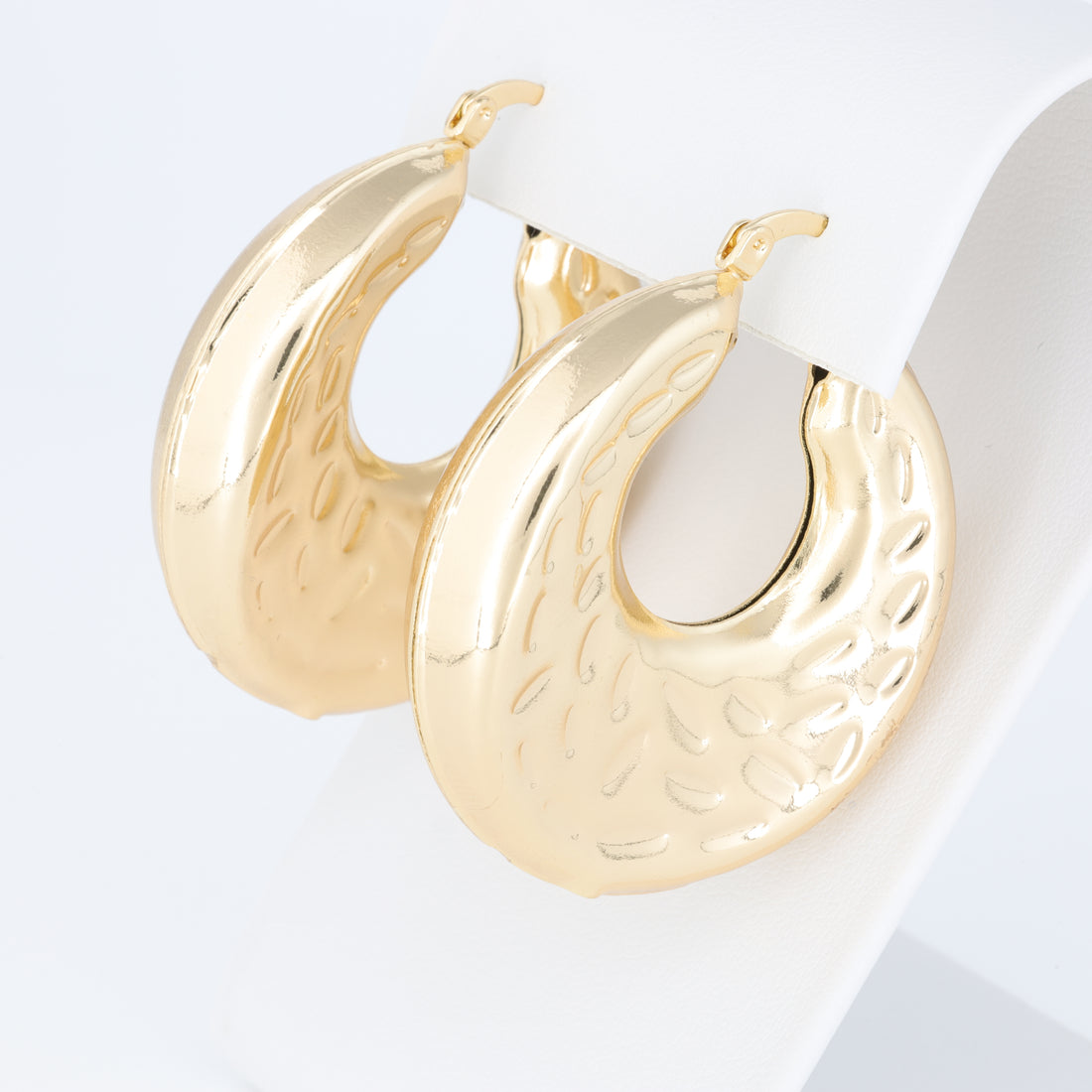 Hoop Earring With A Different Texture And Oval Designs
