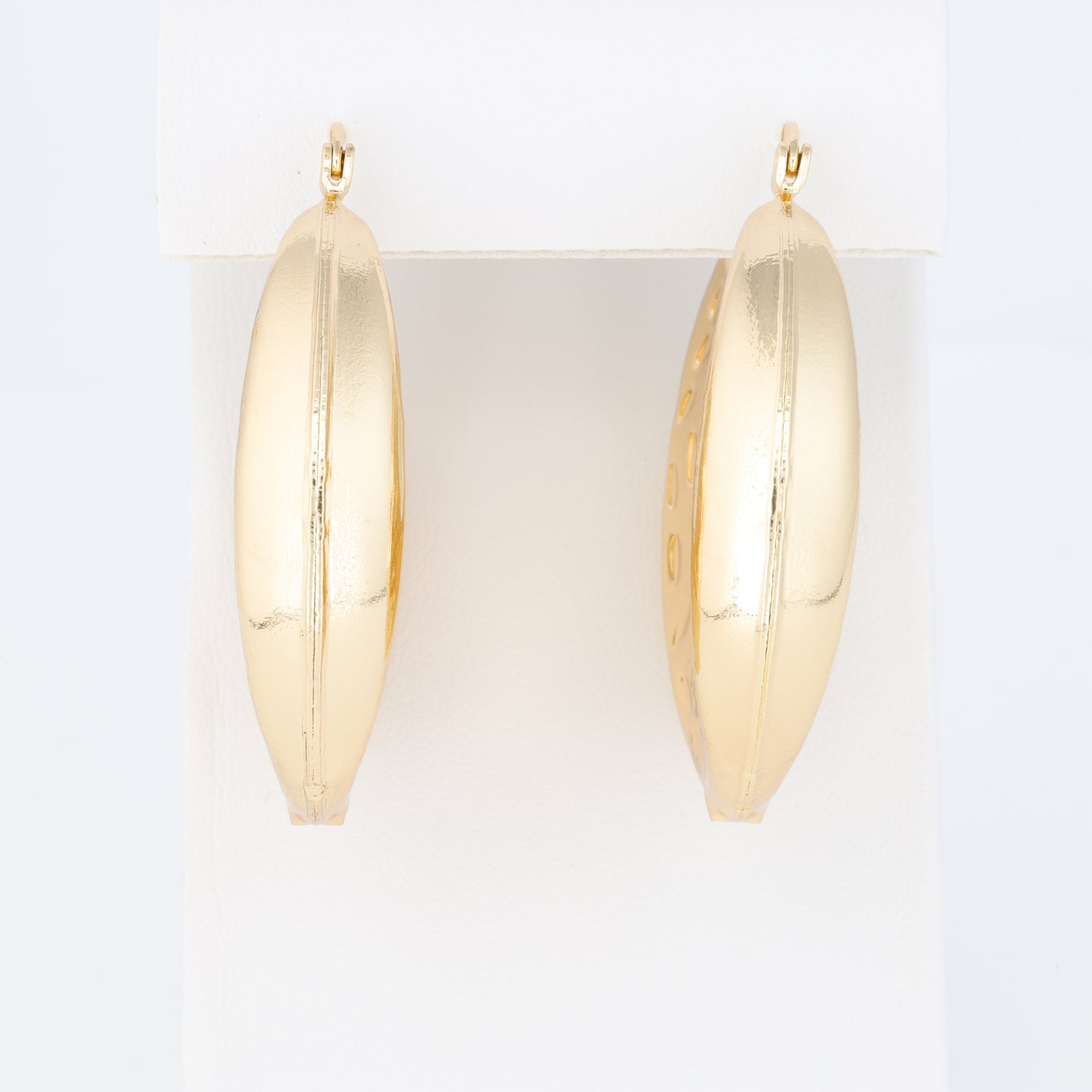 Hoop Earring With A Different Texture And Oval Designs